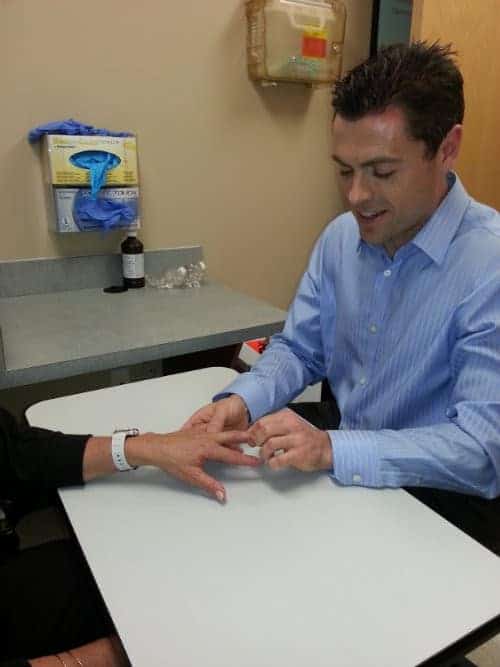 Dr. Riggenbach explains to a patient that arthritis of the hand is a progressive and painful condition that should not be left untreated for an extended period of time. 