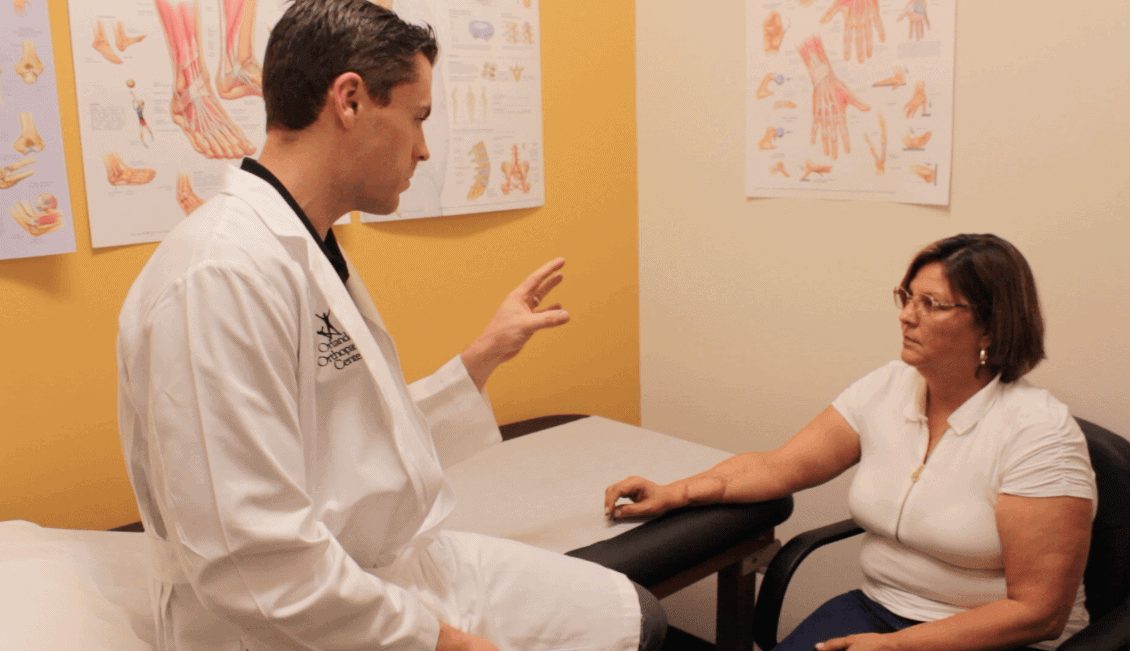 Miriam with Dr. Riggenbach during a follow-up appointment.