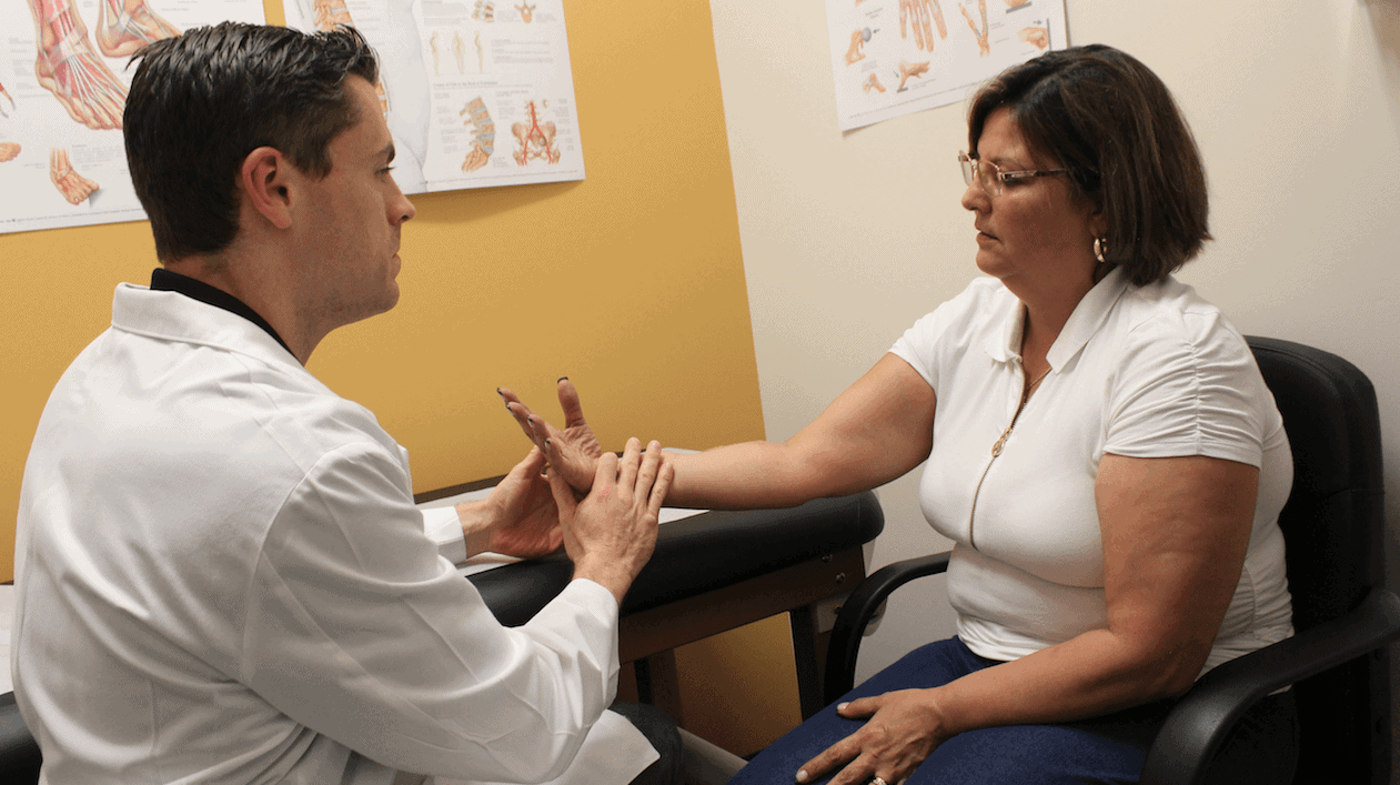 Maria with Dr. Riggenbach during a follow-up appointment.