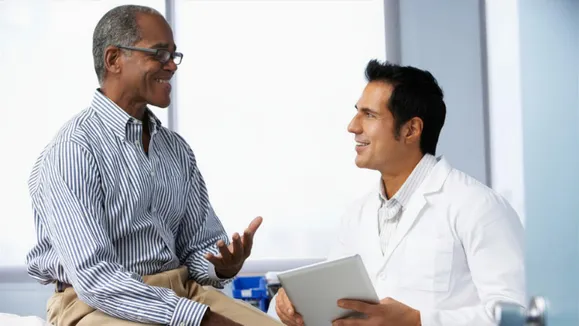 Orthopaedic pain management specialist consulting with a patient about chronic pain treatment
